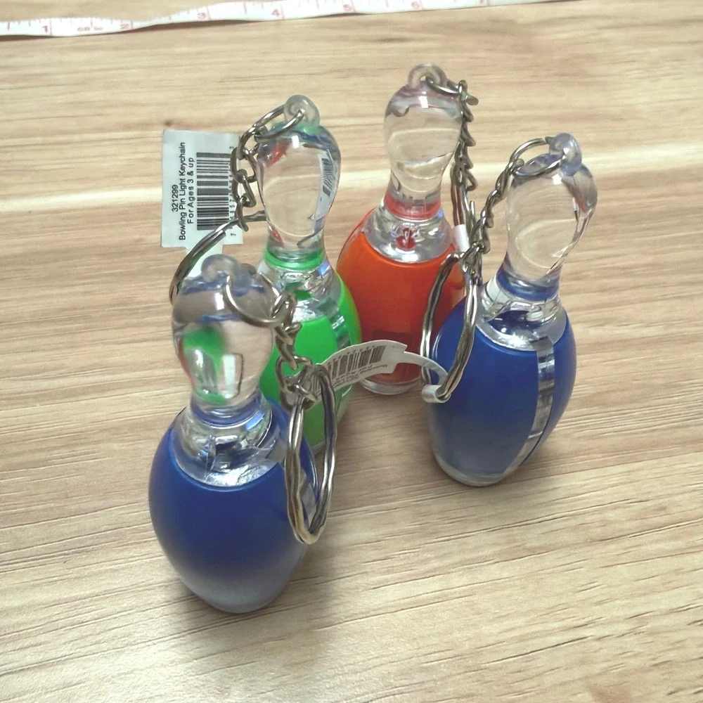 Set of 4 Bowling Pin Light Up LED Keychains Blue Green Orange Novelty
